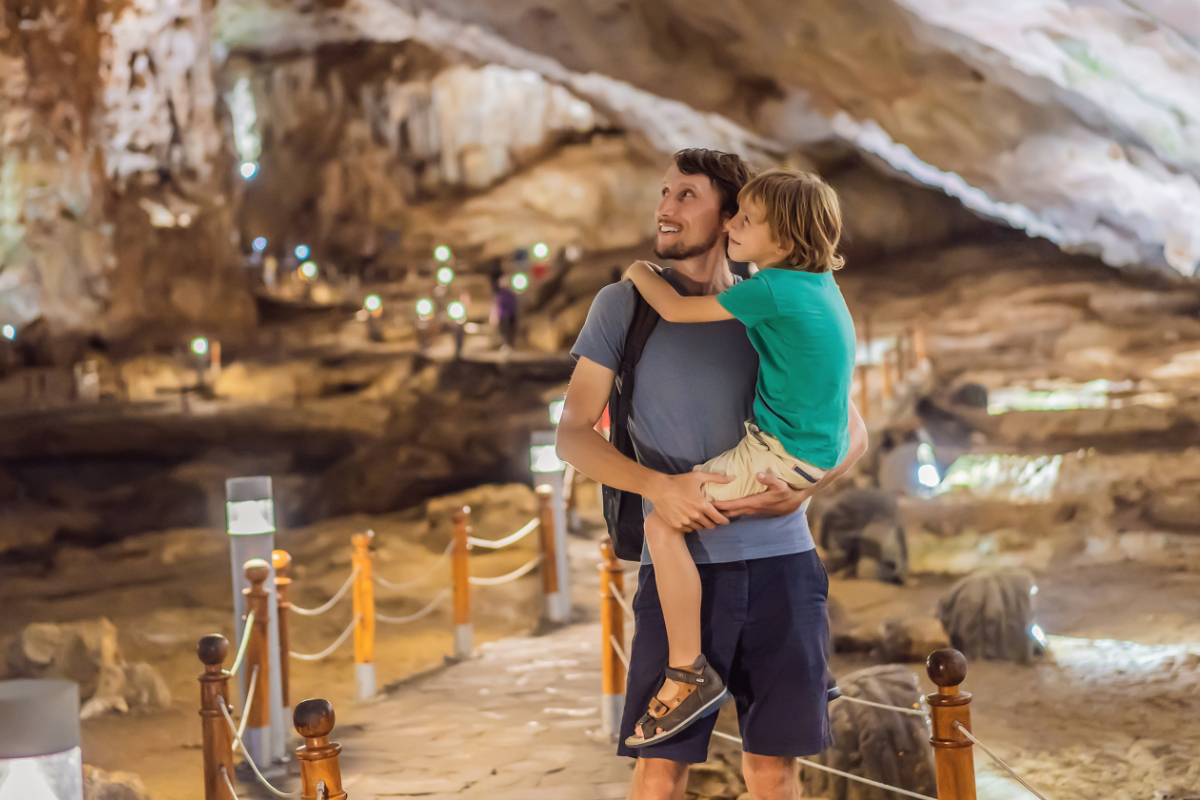 Father And Son On A Cave Tour 1200X800