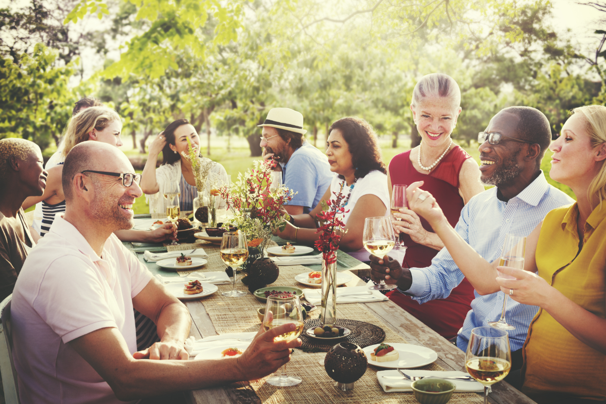 A Gathering Of Friends For Lunch Outside 1200X800